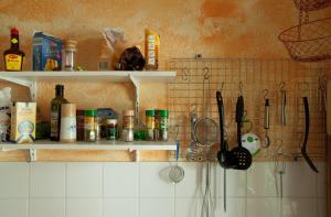 a kitchen counter filled with pots and pans at Hostel Jena in Jena