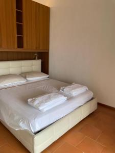 A bed or beds in a room at Residence Kormorano Még 25 kép
