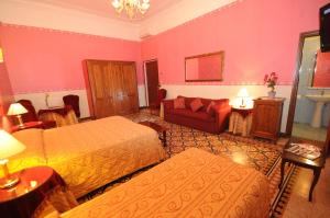 Łóżko lub łóżka w pokoju w obiekcie Hotel Sweet Home