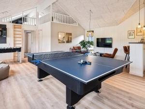 a living room with a pool table in it at 5 star holiday home in Sydals in Sarup