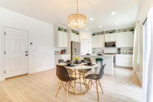 a kitchen and dining room with a table and chairs at 4 Mi to Zions Bank Stadium Sleek Herriman Retreat in Herriman