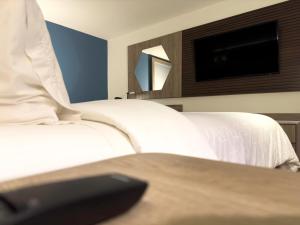 Postel nebo postele na pokoji v ubytování Holiday Inn Express Mérida by IHG