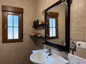 a bathroom with a sink and a mirror at Estrella del alba in Villarino de Sanabria +21 photos