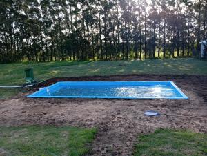 a swimming pool in the middle of a yard at Mukanga in San Pedro