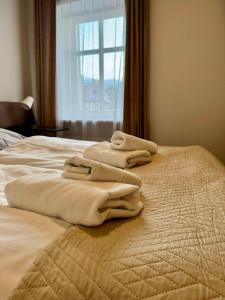 Llit o llits en una habitació de SONATA by WERONA - BUTIK STAY 40 fotos més