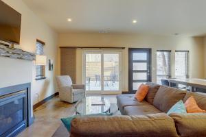 a living room with a couch and a fireplace at Urban Roundabout in Bend