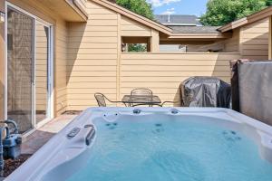 a hot tub in the backyard of a house at Old Mill Magic in Bend