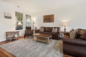 a living room with a couch and a coffee table at Old Mill Magic in Bend