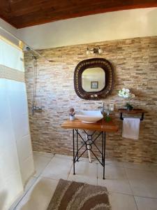 a bathroom with a sink and a mirror at Chacra Mahatma in Tacuarembó