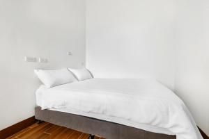 Postel nebo postele na pokoji v ubytování 25Inn Hengchun Kenting