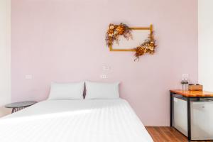 Postel nebo postele na pokoji v ubytování 25Inn Hengchun Kenting