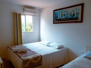 Ένα ή περισσότερα κρεβάτια σε δωμάτιο στο Suites Porto Dos Milagres