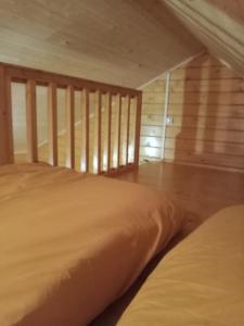 Postel nebo postele na pokoji v ubytování chalet le cocon de bois