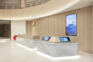 TV a/nebo společenská místnost v ubytování Quanji shanghai Hongqiao Gubei No 1 hotel
