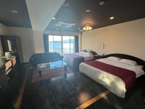 Postel nebo postele na pokoji v ubytování ホテル ラヴィアン HOTEL Lavien