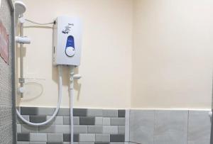 a shower stall in a bathroom with a shower at RGL Pinamalayan Condotel by RedDoorz in Pinamalayan