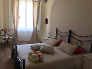 Posteľ alebo postele v izbe v ubytovaní L'Iris B&B