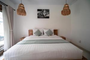 Postel nebo postele na pokoji v ubytování The Eight Villa & Rooms Bali - Seminyak