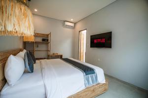 Postel nebo postele na pokoji v ubytování The Eight Villa & Rooms Bali - Seminyak