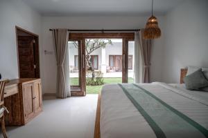 Postel nebo postele na pokoji v ubytování The Eight Villa & Rooms Bali - Seminyak + 37 fotografií