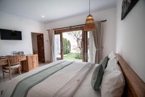 Postel nebo postele na pokoji v ubytování The Eight Villa & Rooms Bali - Seminyak
