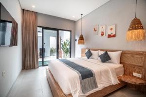 Postel nebo postele na pokoji v ubytování The Eight Villa & Rooms Bali - Seminyak