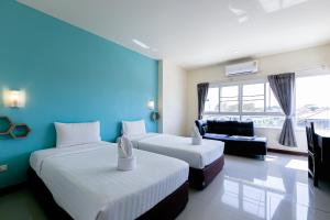 Postel nebo postele na pokoji v ubytování Panwalee Hotel + 91 fotografií