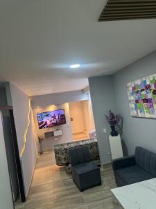 TV i/ili multimedijalni sistem u objektu Apartaestudio altos de riomar