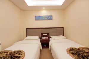 Katil atau katil-katil dalam bilik di Yiju Hotel Beijing South Railway Station Muxiyuan Branch