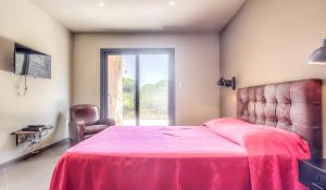 Posteľ alebo postele v izbe v ubytovaní Appartement spacieux à Porto-Vecchio avec piscine partagéeB