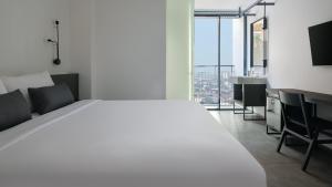 Postel nebo postele na pokoji v ubytování REZ Hotel + 35 fotografií