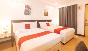Postel nebo postele na pokoji v ubytování RedDoorz at City Stay Inns Marilao
