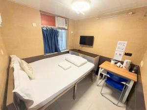 TV in/ali zabaviščno središče v nastanitvi Apple Hostel 蘋果賓館