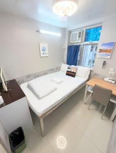 Postelja oz. postelje v sobi nastanitve Apple Hostel 蘋果賓館