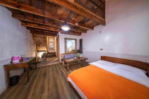 Кровать или кровати в номере Xiangzixi Bed and Breakfast