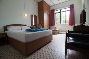 Postel nebo postele na pokoji v ubytování Peking Hotel