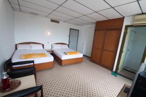Postel nebo postele na pokoji v ubytování Peking Hotel