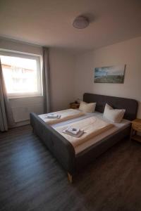 Postel nebo postele na pokoji v ubytování Hafenapartments-Aurich
