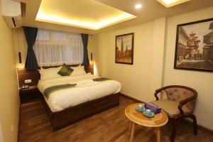 Letto o letti in una camera di Harsha Boutique Hotel