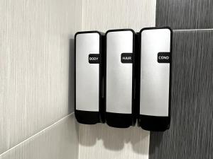 two black and white switches on a wall at The SeaScape Inn in San Francisco