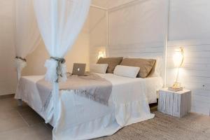 Ένα ή περισσότερα κρεβάτια σε δωμάτιο στο Notti Ad Oriente