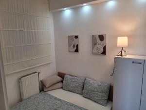 Postel nebo postele na pokoji v ubytování APARTMANI Emerald Dream