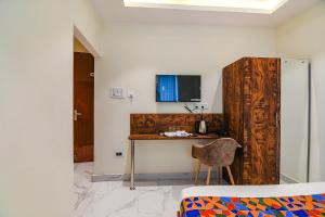 a room with a desk with a chair and a computer at FabHotel The Hastings Club - Nr Victoria Memorial in Kolkata