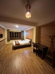 Postel nebo postele na pokoji v ubytování Hotel Durbar Side