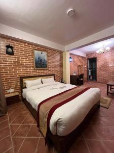 Postel nebo postele na pokoji v ubytování Hotel Durbar Side