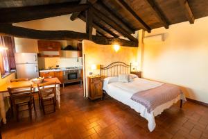 Postel nebo postele na pokoji v ubytování Agriturismo Bassanella