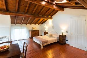 Postel nebo postele na pokoji v ubytování Agriturismo Bassanella