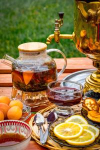 a pot of tea on a table with lemons at Tash-Rabat Ethno complex in At-Bashy +17 photos