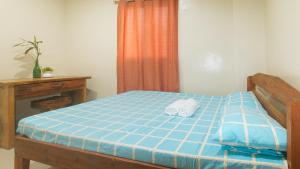 Voodi või voodid majutusasutuse Bello Vue Apartelle toas