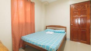 Postel nebo postele na pokoji v ubytování Bello Vue Apartelle